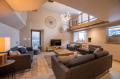 Spacious lounge area with access to garden and deck